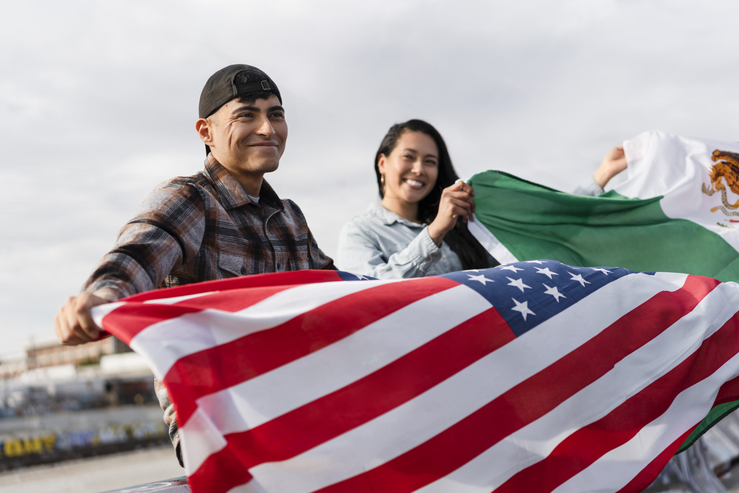 young-couple-with-flags-river